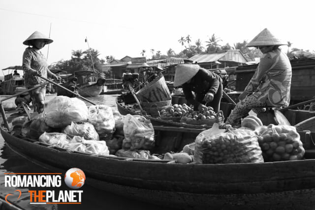 Woman selling fruits at the Cai Rang Floating Market