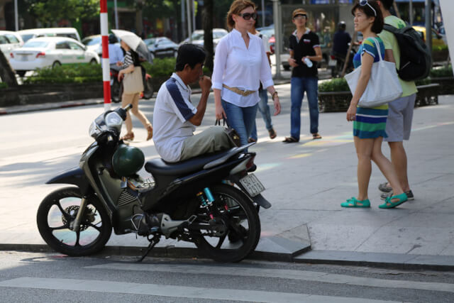 Xe Om driver waiting for passenger, Ho Chi Minh City