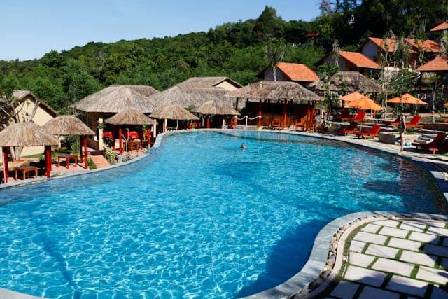 Take a dip at the swimming pool during a hot day