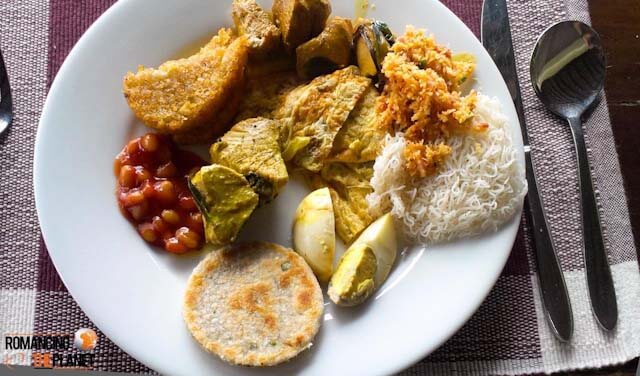 My breakfast at Jetwing Lagoon - Starting from boiled egg (left to right) Pol Roti, Bean Sauce, Hash Brown, Chicken Curry, Pol Sambol, String Hoppers & in between Fish Curry and Chinese Omelette.