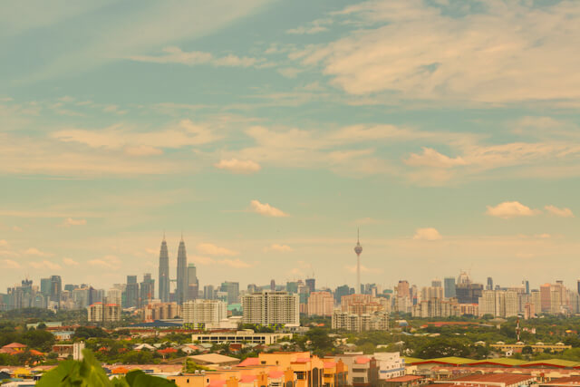 Spotting Petronas Towers (the tallest building on left)and KL Manera (the tallest tower on right) from the top of Batu Caves